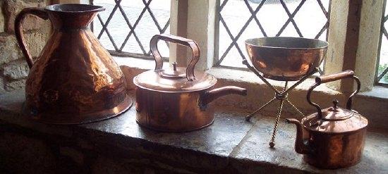 Appraisal: A Spanish copper bowl on a brass folding cat cm