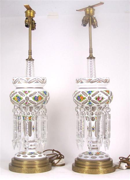 Appraisal: A pair of Bohemian glass white overlay lustre lamps the