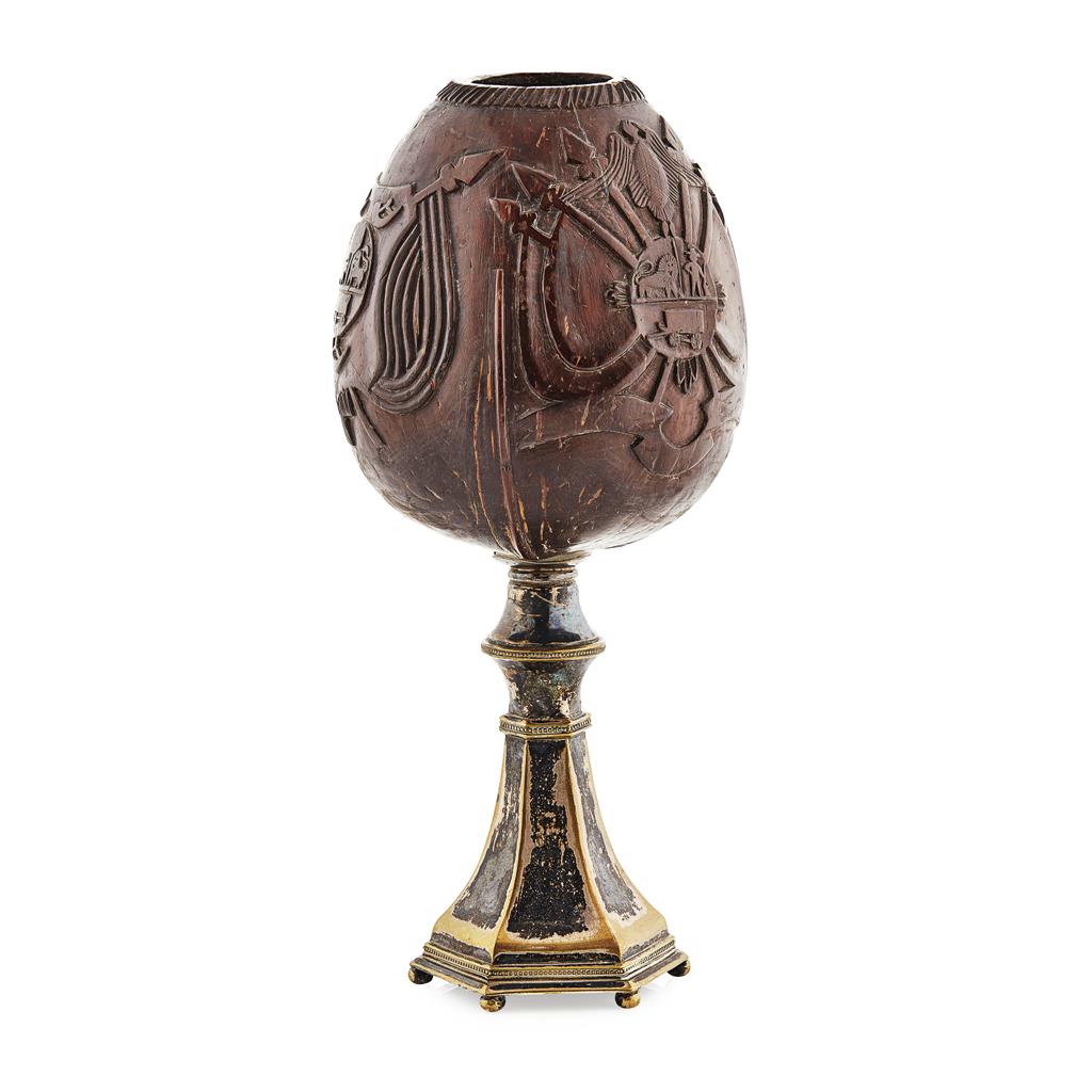 Appraisal: A th century carved coconut cup on a silver plated