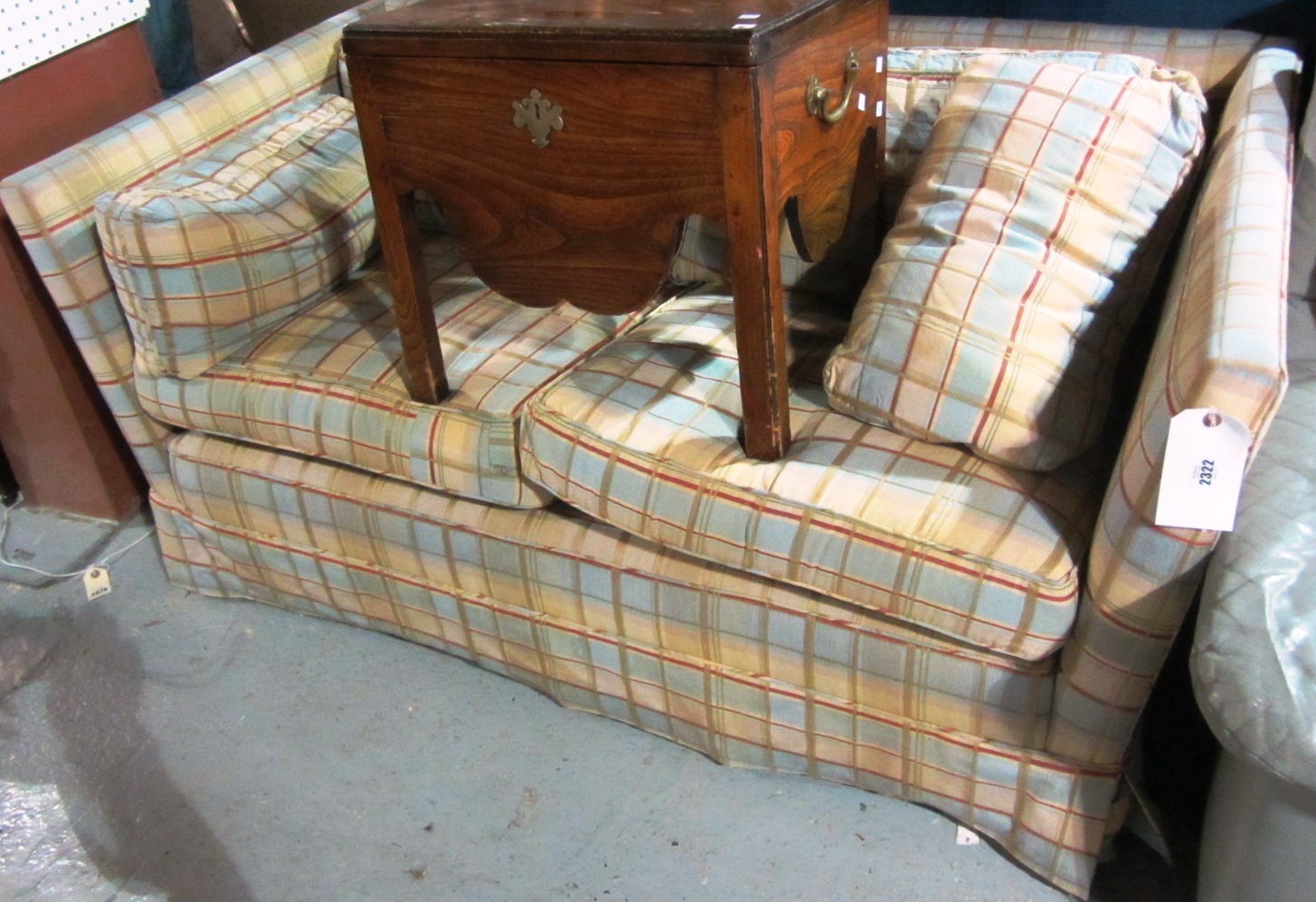 Appraisal: A small th century two seat sofa upholstered in a