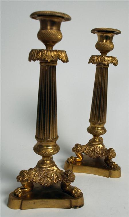 Appraisal: A pair of th century French gilt metal candlesticks In