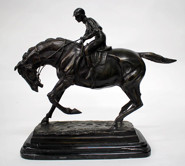 Appraisal: A BRONZE SCULPTURE OF A HORSE AND JOCKEY signed Mene