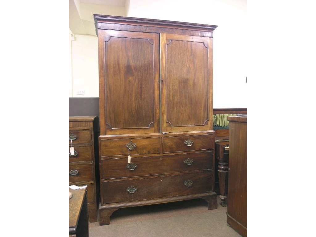 Appraisal: A George III mahogany linen press pair of panelled doors