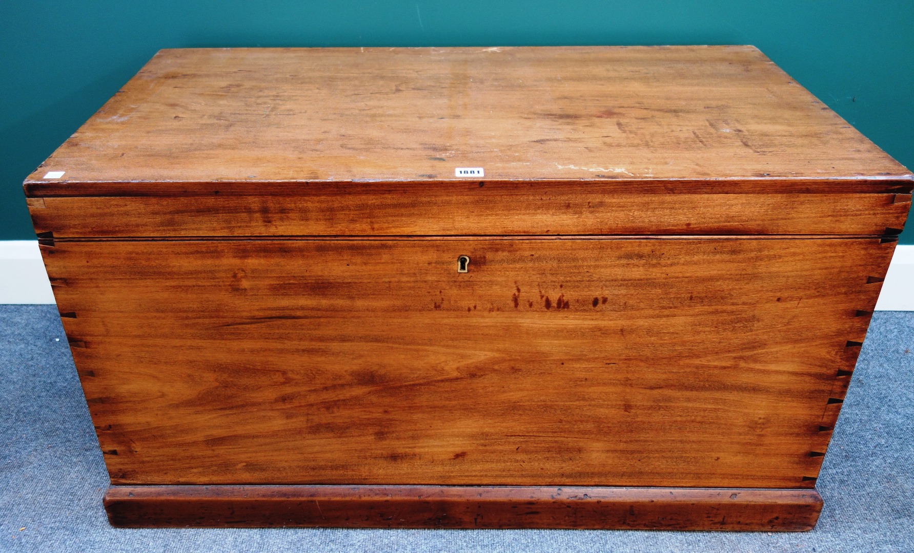 Appraisal: A rectangular hardwood trunk with visible dovetails on a plinth