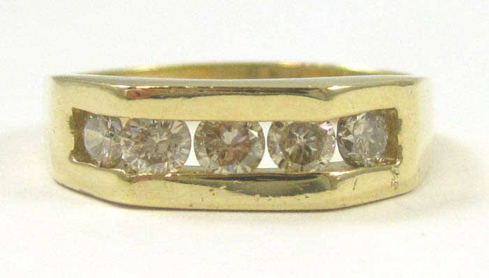 Appraisal: MAN'S DIAMOND AND FOURTEEN KARAT GOLD RING set with five