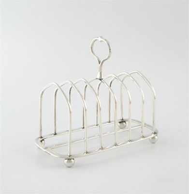 Appraisal: A Victorian silver seven-bar toast rack by R Sibley London