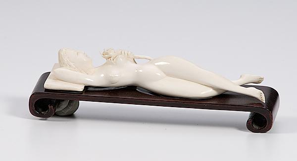 Appraisal: ASIAN CARVED IVORY RECLINING LADY Chinese th century carved ivory