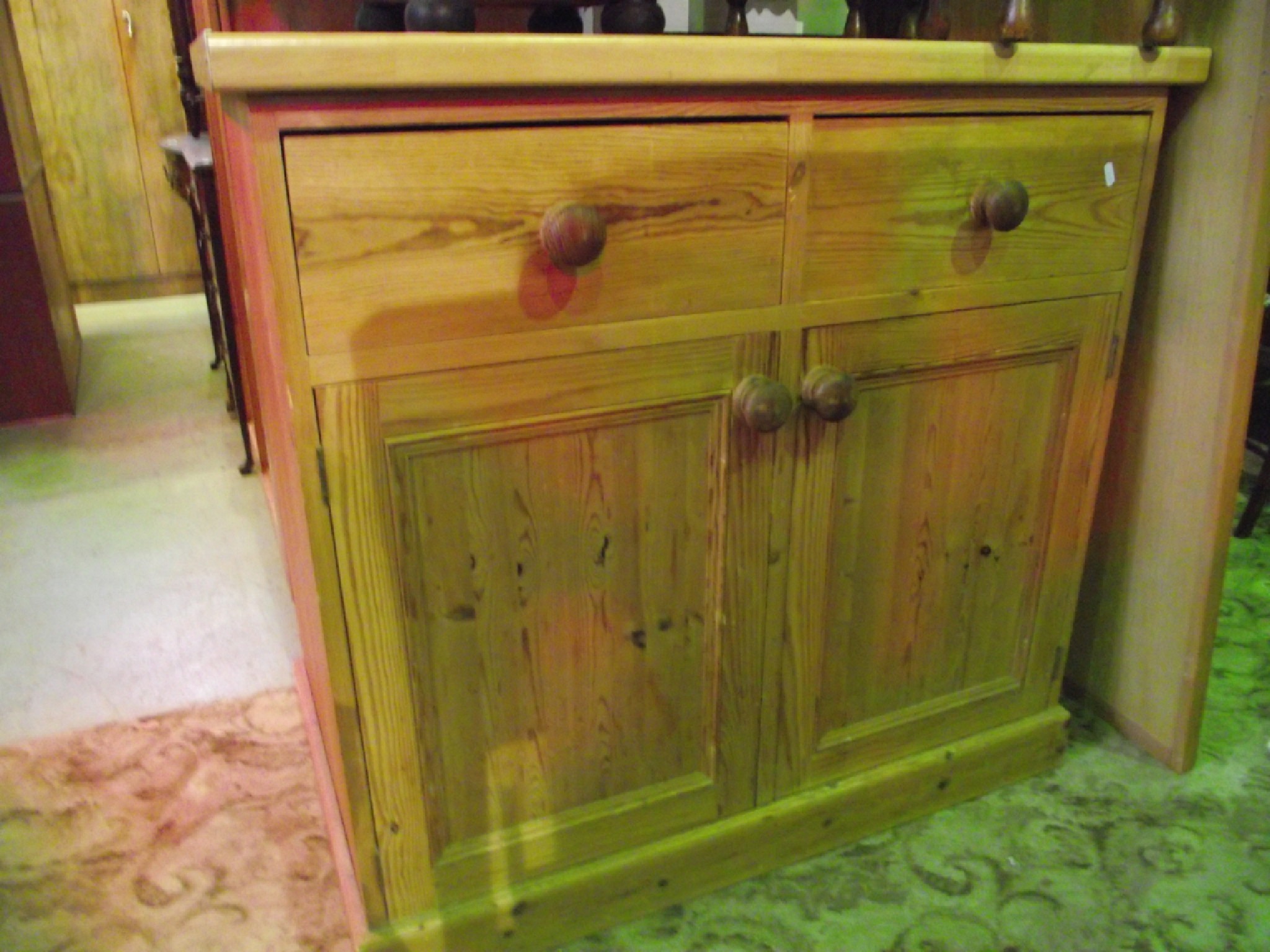 Appraisal: A solid stripped pine kitchen side cupboard enclosed by a