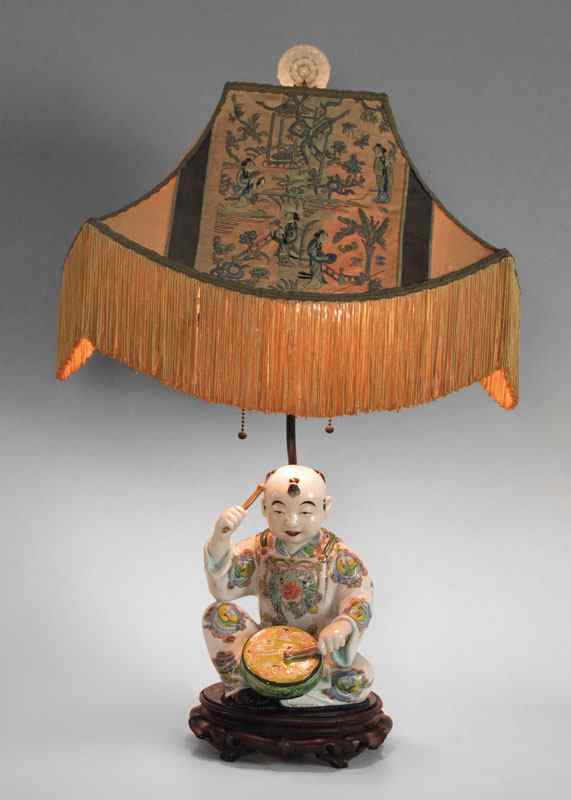 Appraisal: CHINESE PORCELAIN FIGURAL LAMP With original embroidered and fringed silk