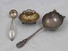 Appraisal: A mixed lot of silver comprising a tea strainer Sheffield