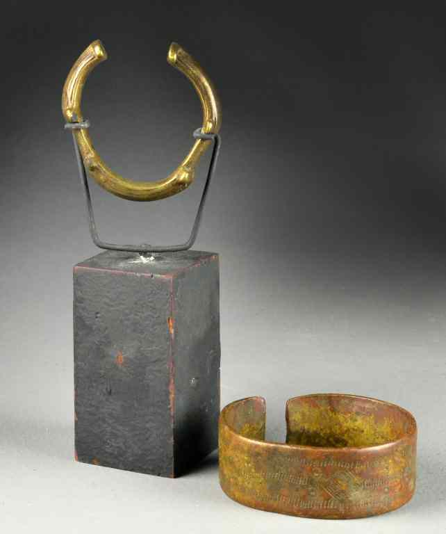 Appraisal: African Tribal Copper Or Brass Cuff BraceletsTo include an unusual