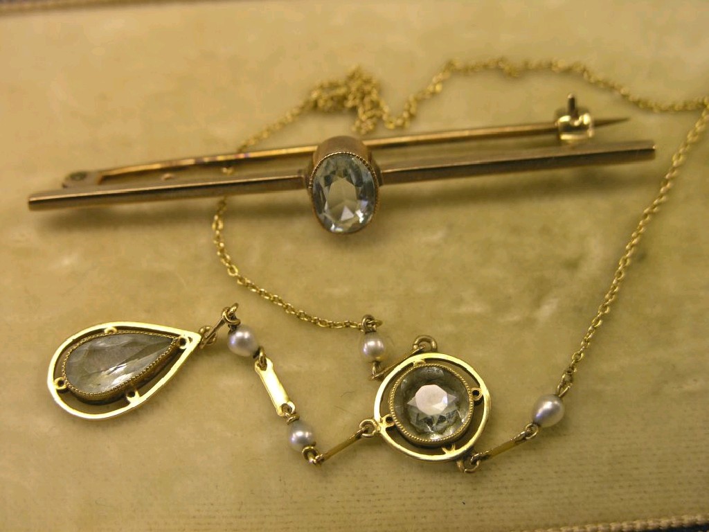 Appraisal: A ct gold bar brooch set oval aquamarine and a