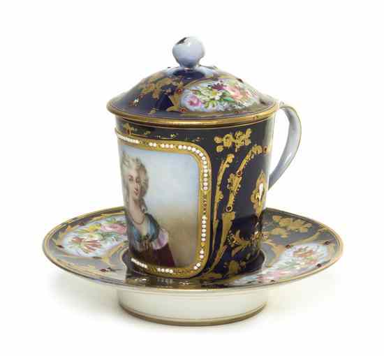 Appraisal: A Sevres Style Porcelain Covered Cup and Saucer the cup