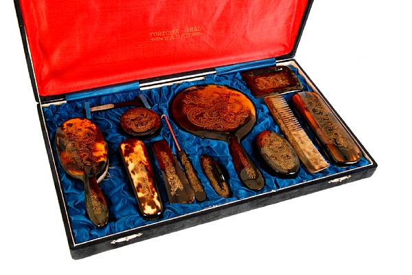 Appraisal: A Chinese tortoise shell vanity set in velvet lined box