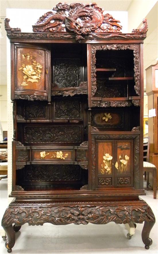 Appraisal: Japanese cabinet c with pierced dragon crest and carved ivory