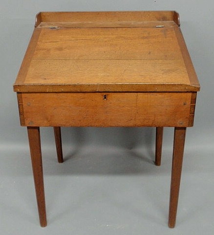 Appraisal: Pennsylvania walnut schoolmaster's desk early th c with dovetailed construction