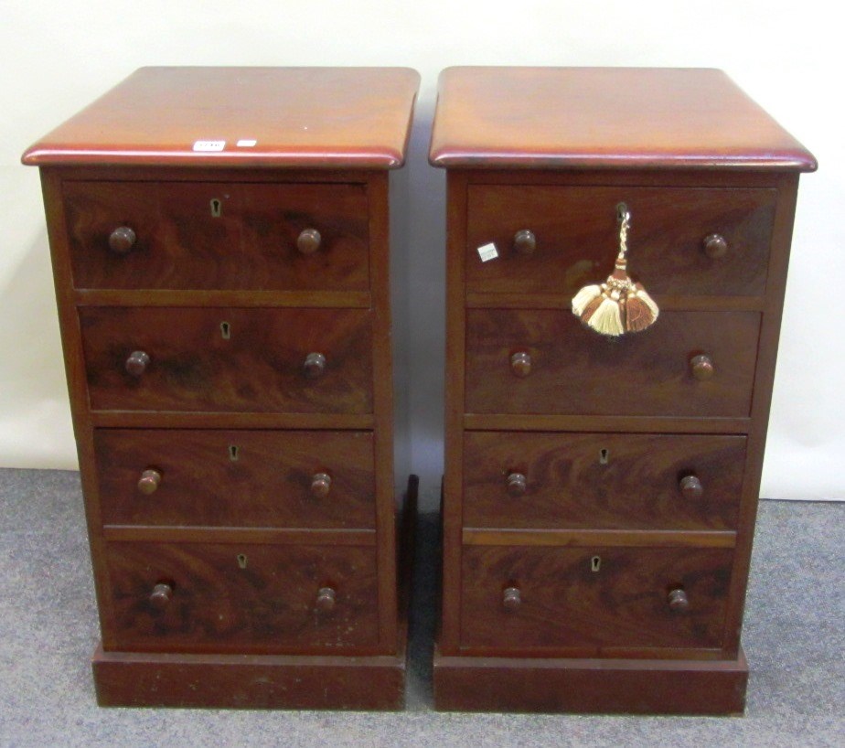 Appraisal: A pair of th century mahogany four drawer pedestals on