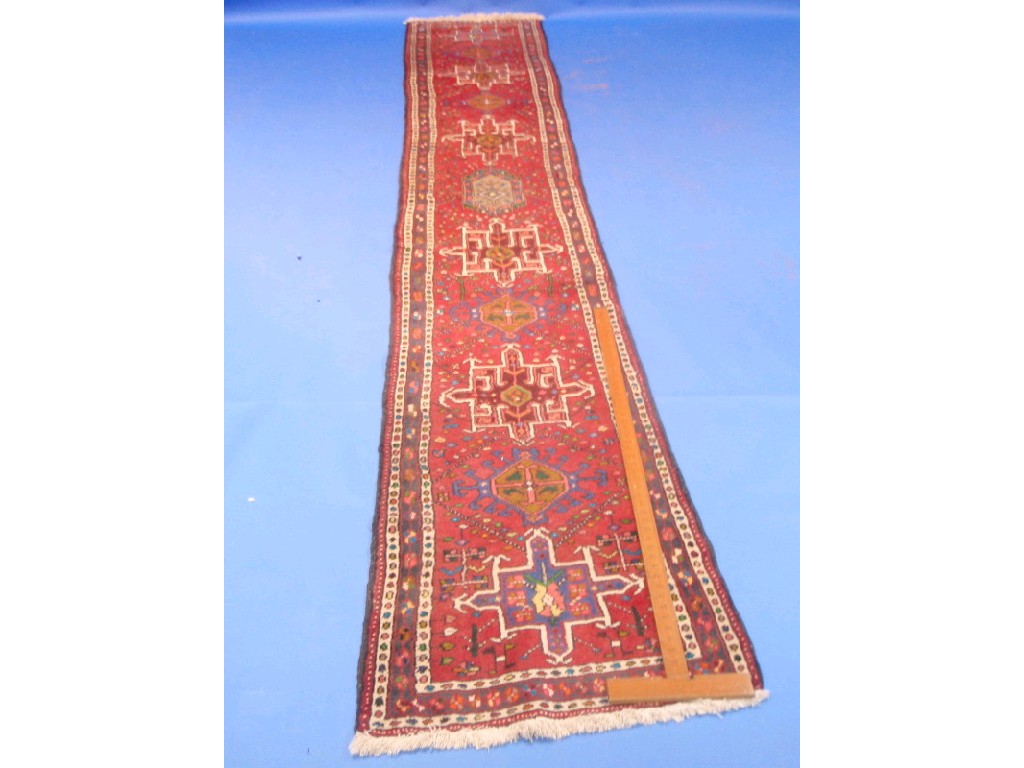 Appraisal: A red ground Turkish runner cm x cm