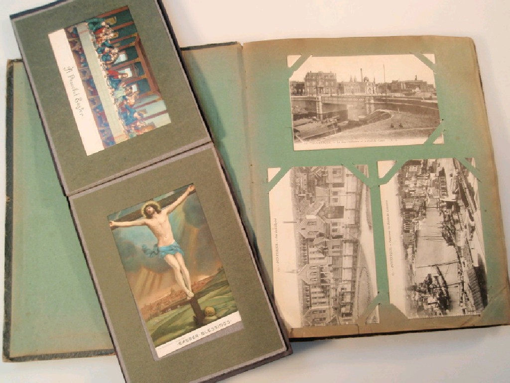 Appraisal: A WWI period postcard album with approximately cards mainly Europe