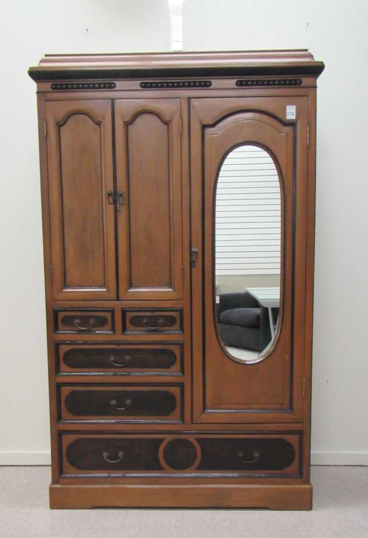 Appraisal: VICTORIAN ANGLO-JAPANESE WARDROBE th century the front featuring three doors