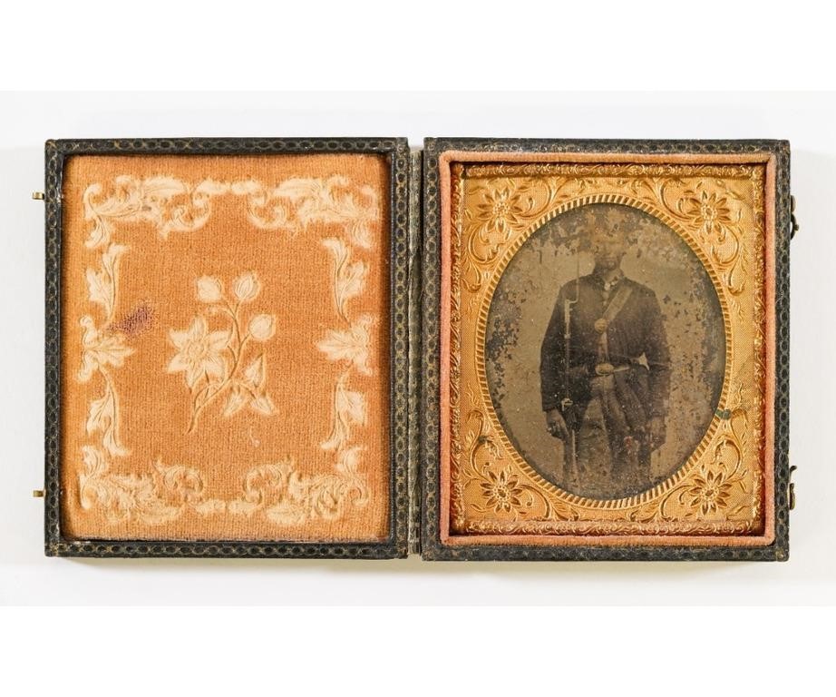 Appraisal: Tintype of a Civil War soldier holding a musket with