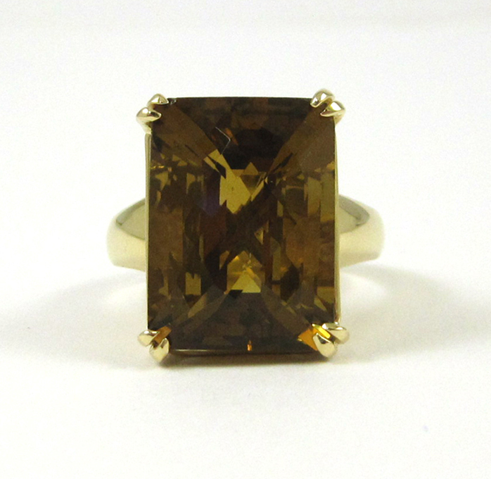 Appraisal: SMOKY CITRINE AND FOURTEEN KARAT GOLD RING set with a