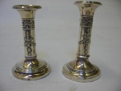 Appraisal: A PAIR OF EDWARDIAN MINIATURE CANDLESTICKS by Levi Salaman Birmingham