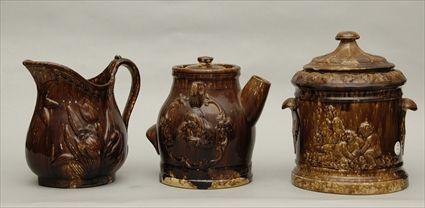 Appraisal: Rockingham-Glazed Pitcher and Cover Teapot and another Pitcher