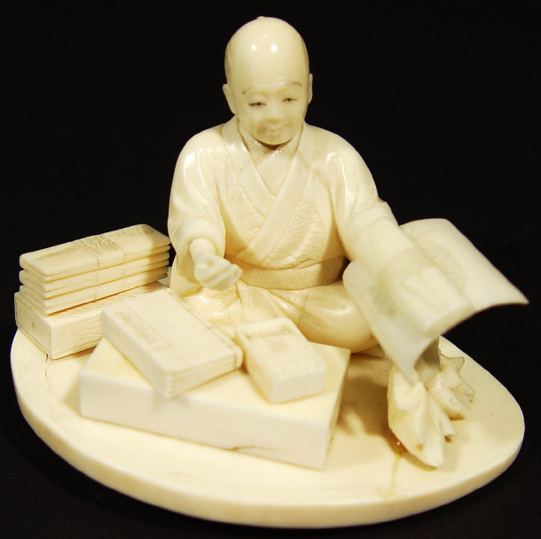 Appraisal: Oriental ivory figure of a scholar seated with books and