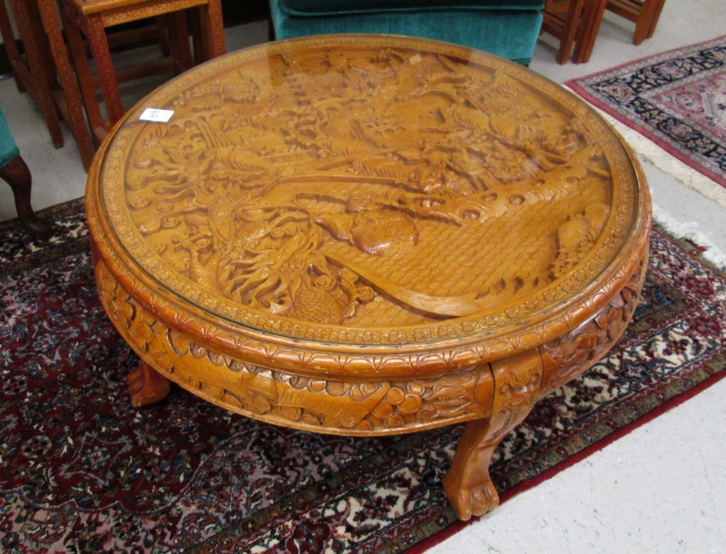 Appraisal: ROUND COFFEE TABLE Chinese th century having a pictorial relief-carved