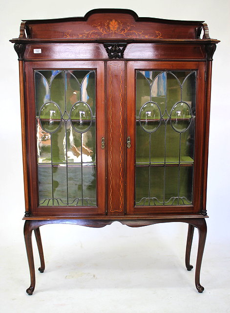 Appraisal: AN EDWARDIAN MAHOGANY DISPLAY CABINET with raised decoratively inlaid floral