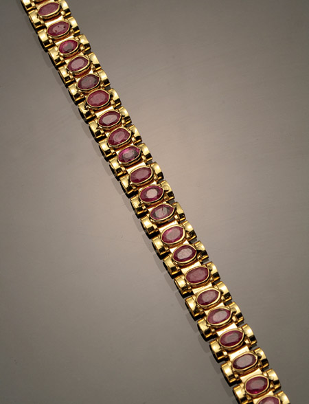 Appraisal: -Karat Yellow-Gold and Ruby Bracelet Set with forty-two oval faceted