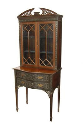 Appraisal: An Edwardian mahogany display cabinet on stand with blind fret