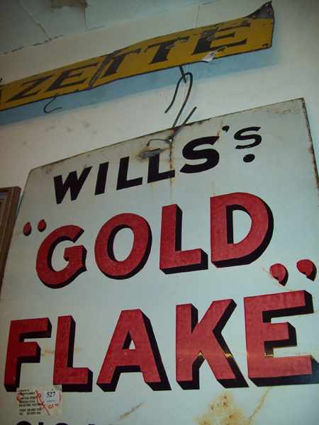 Appraisal: A GOLD FLAKE ENAMEL SIGN AND ONE 'EVENING GAZETTE' ENAMEL