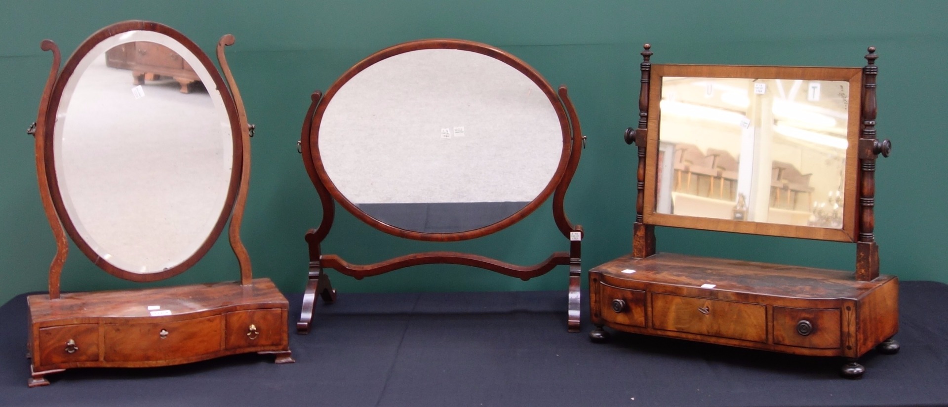 Appraisal: A George III mahogany toilet mirror with serpentine three drawer