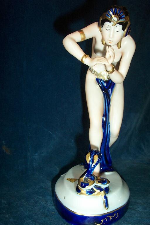 Appraisal: A Royal Dux figure of a scantily clad female snake