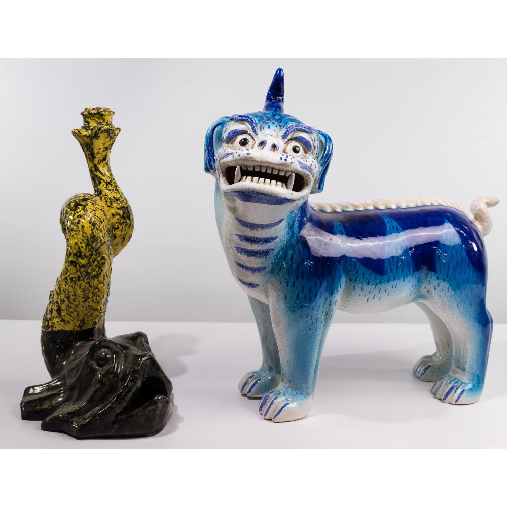 Appraisal: ASIAN CERAMIC FOO DOG AND CLAY FISHBlue standing foo dog