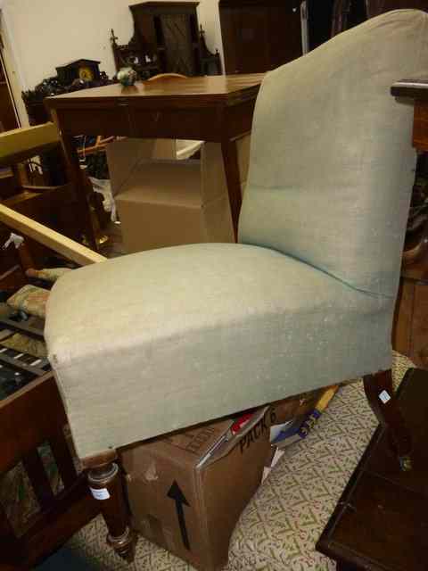 Appraisal: A TH CENTURY MAHOGANY LOW GREEN UPHOLSTERED NURSING CHAIR standing