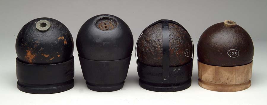 Appraisal: LOT OF FOUR -POUNDER CANNONBALLS All excavated -pounder Bormann fused