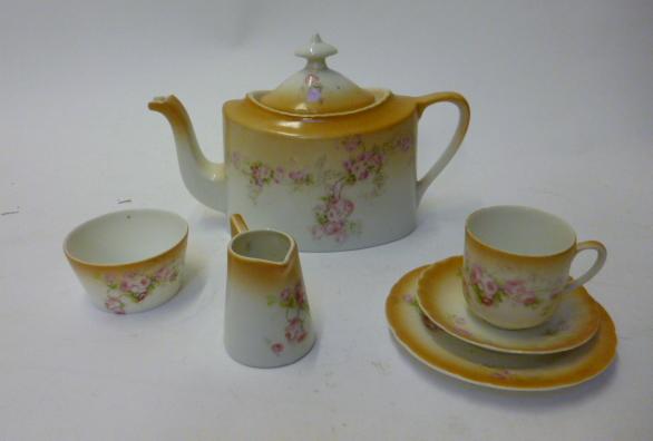 Appraisal: A doll's porcelain tea service with flowered decoration comprising teapot