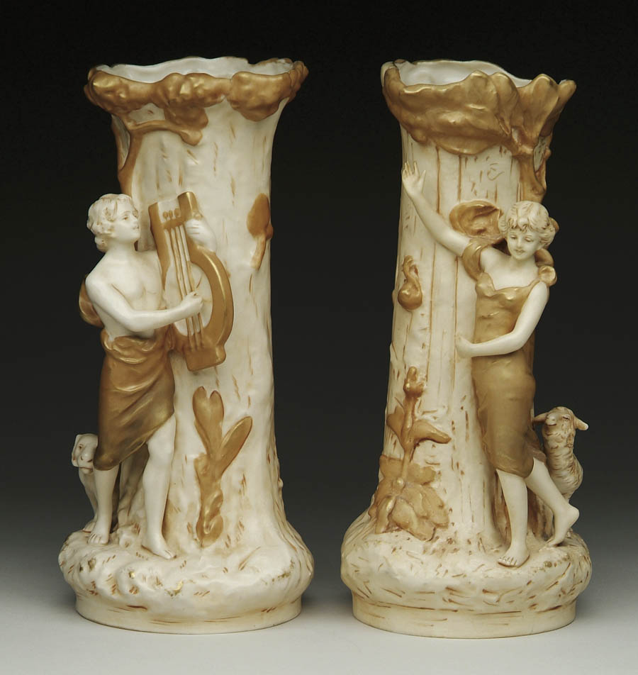 Appraisal: PAIR OF ROYAL DUX FIGURAL VASES In light ivory and