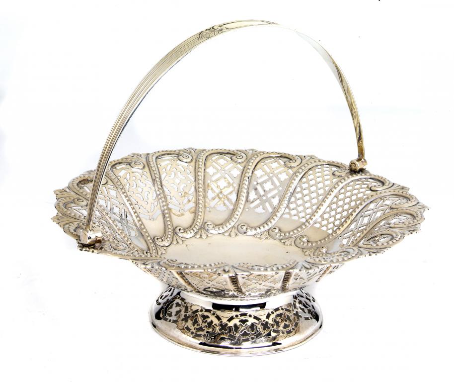 Appraisal: A VICTORIAN CIRCULAR CAKE BASKET embossed with beaded scrolls and