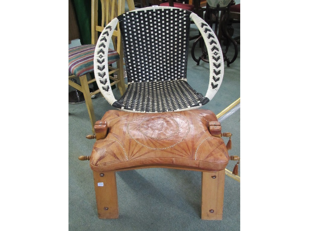 Appraisal: Wicker chair and a camel stool