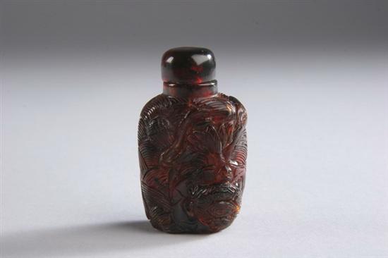 Appraisal: CHINESE AMBER SNUFF BOTTLE Rectangular form carved to depict two