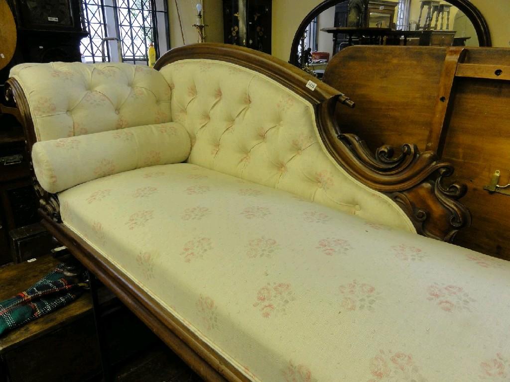 Appraisal: A Victorian chaise lounge with upholstered seat and button back