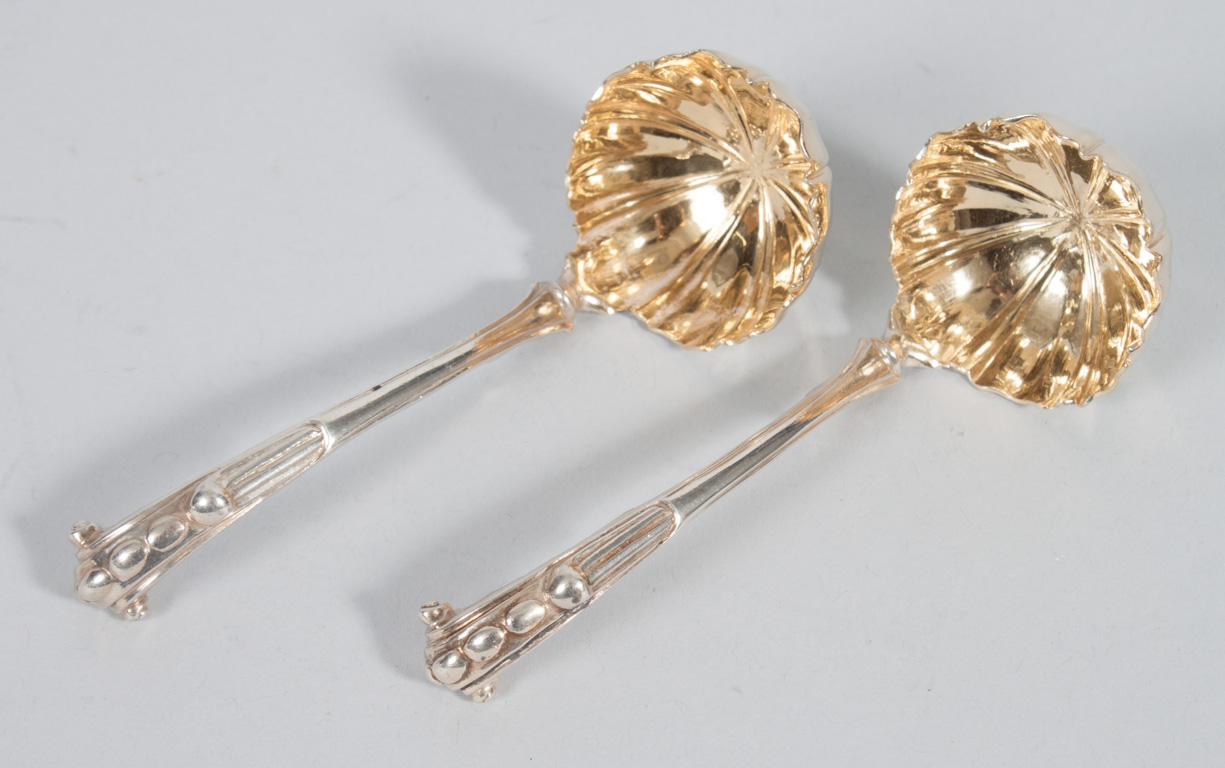 Appraisal: Pair of English sterling silver sauce ladles George Fox London