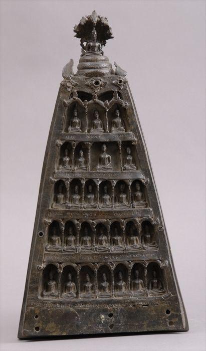 Appraisal: THAI BRONZE TRIANGULAR STELE Incorporating graduated tiers of seated priests