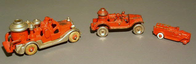 Appraisal: Three cast iron toy fire engines Longest