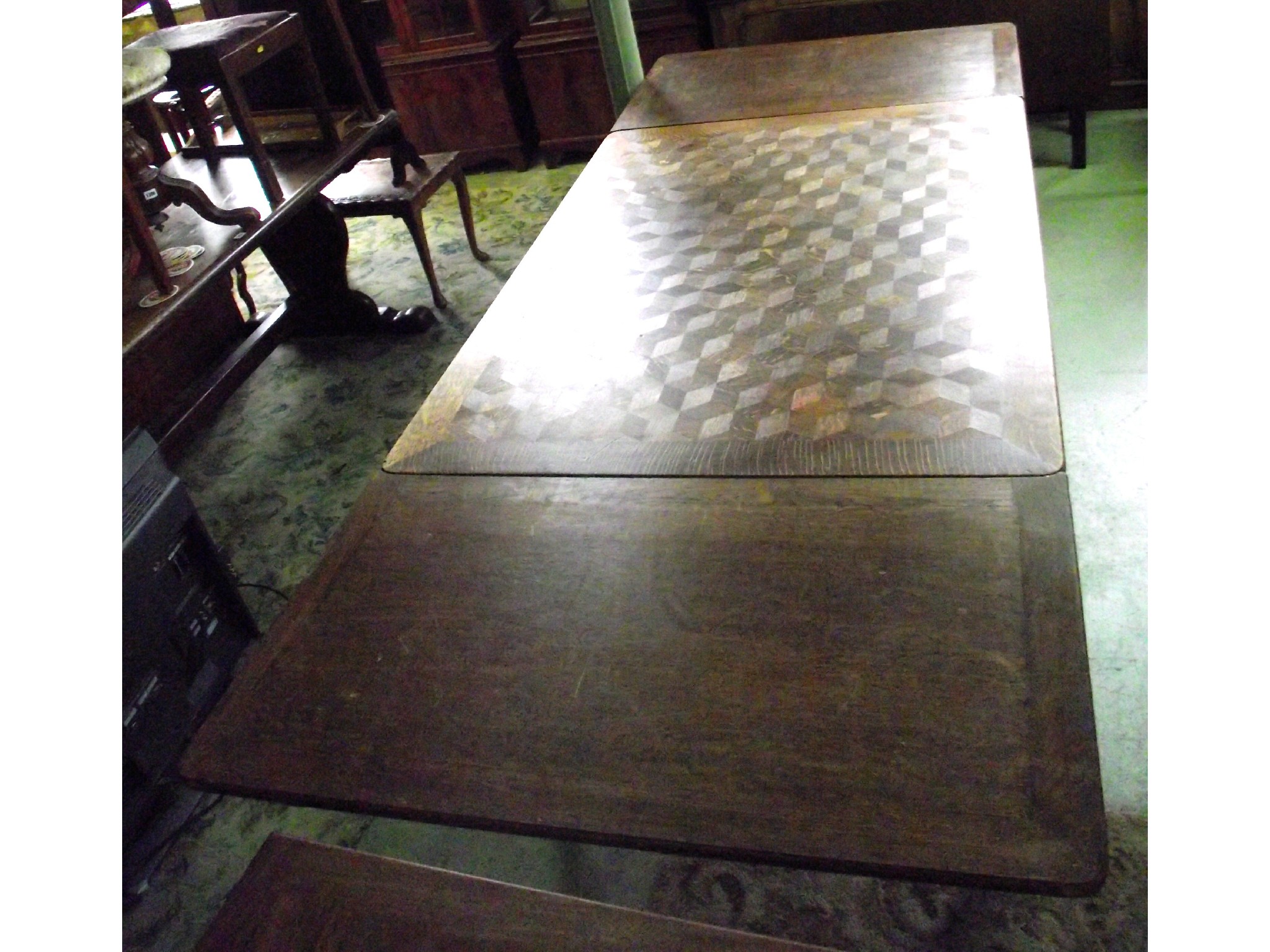 Appraisal: A continental oak drawerleaf dining table the central leaf with