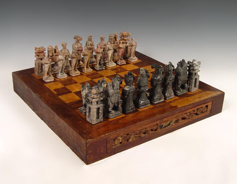 Appraisal: LARGE CHESS BOARD WITH CARVED SOAPSTONE PIECES Chinese carved soapstone